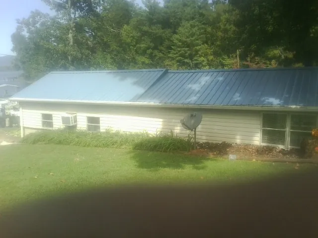 Blue metal roof running the length of a single story home in Dateland